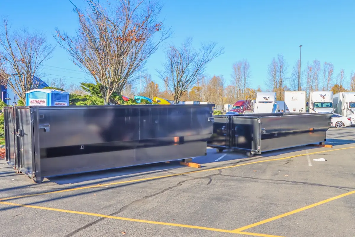 Professional dumpster rental service with roll-off container on residential driveway in Galena Park